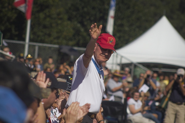 Marine Cpl. Duane Dewey waves at Alachua County's 2013 Veterans Day ceremony. Photo by Michael Stone