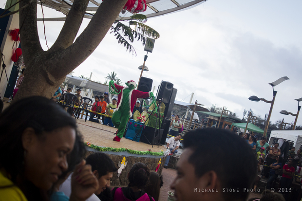 Residents of Puerto Ayora on Santa Cruz Island gather for a 2013 Christmas celebration, complete with the Grinch.